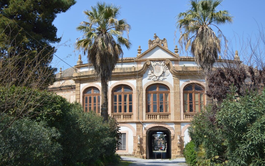 A villa in Palermo Sicily with two palm trees in the front