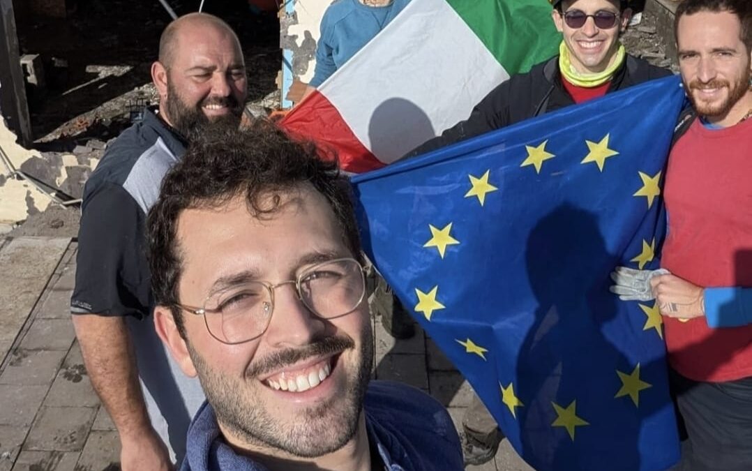 Cyclone Harry Sicily volounteers showing flags found under debries