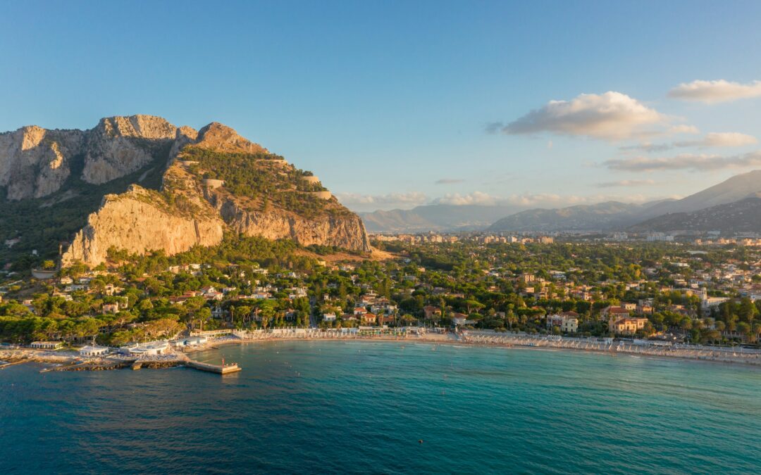 Visiting Sicily in spring — Mondello beach Palermo with turquoise sea and golden sunset light