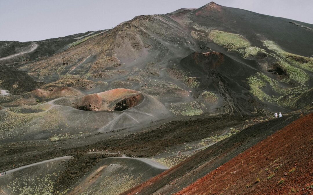 Hiking Mount Etna volcanic craters lava landscape Sicily trekking.